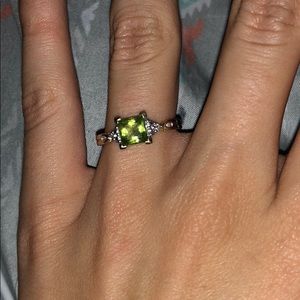 Green and golden ring with diamond accents